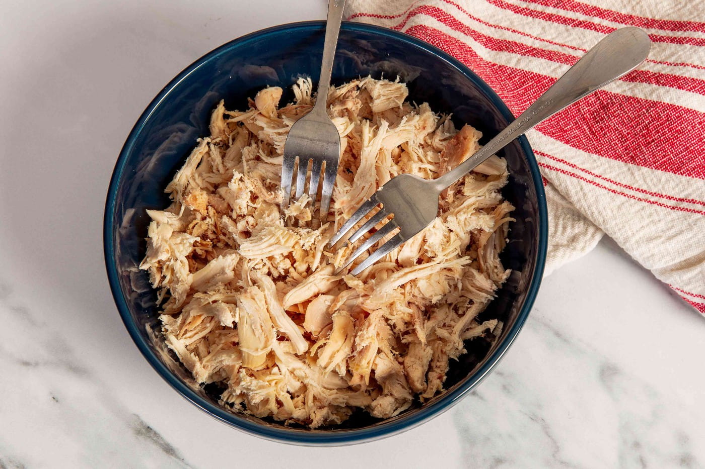 https://www.mccormick.com/-/media/project/oneweb/mccormick-us/mccormick/articles/shredded-chicken-is-the-easiest-meal-prep-hack-url.jpeg?rev=9fab5e0c1227486f908ec31a81669d2c&vd=20230615T090434Z&hash=30BA8E8DF3B95A44D6DB6DA20628956A